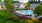 a swimming pool in a courtyard with lounge chairs